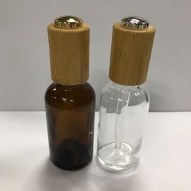 De Flessen van het glasdruppelbuisje, van de de Kraaghuid van 30ml Amber Essential Oil Bottle With Houten OEM van de de Zorgfles